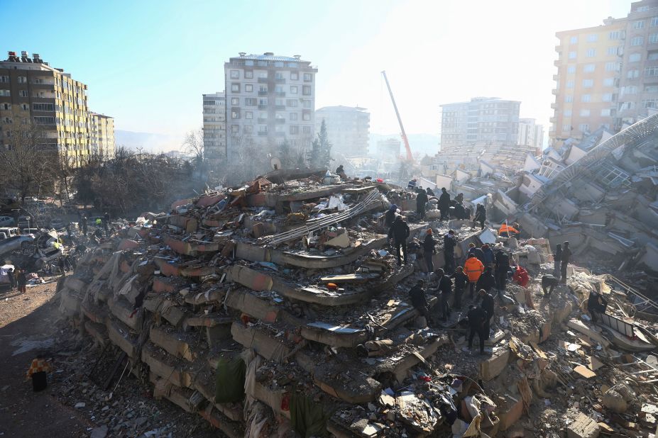 People work at the site of a collapsed building in Kahramanmaras on February 8.