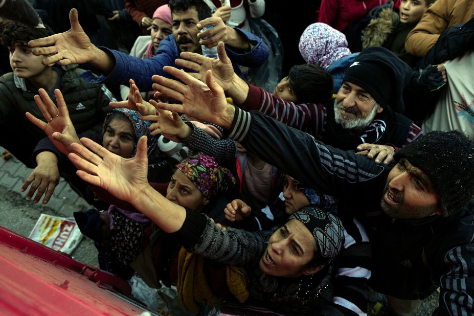 Volunteers distribute aid to people in Antakya on February 8.