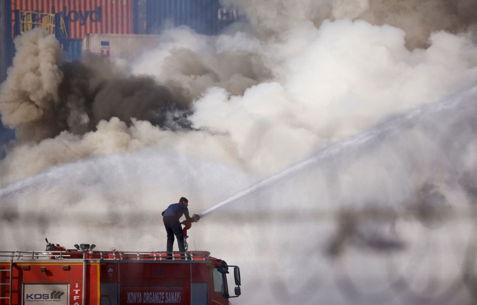 A firefighter works at the Turkish port of Iskenderun, where a fire broke out in the aftermath of the quake.