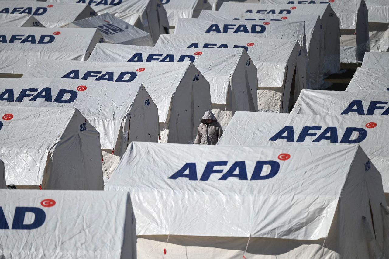 A person walks among tents in Kahramanmaras on February 8.