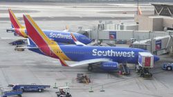 Southwest Airlines planes parked at Gates D4 and D6 in Terminal 4 of the Sky Harbor International Airport, Friday, Dec. 30, 2022, in Phoenix. (Kirby Lee via AP)