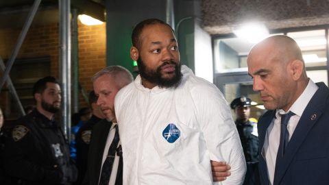 Randy Jones is escorted from a police precinct in New York on Tuesday.