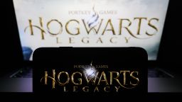 Hogwarts Legacy logo displayed on a phone screen and Hogwarts Legacy website displayed on a laptop screen in the background are seen in this illustration photo taken in Krakow, Poland on February 8, 2023. (Photo by Jakub Porzycki/NurPhoto via Getty Images)