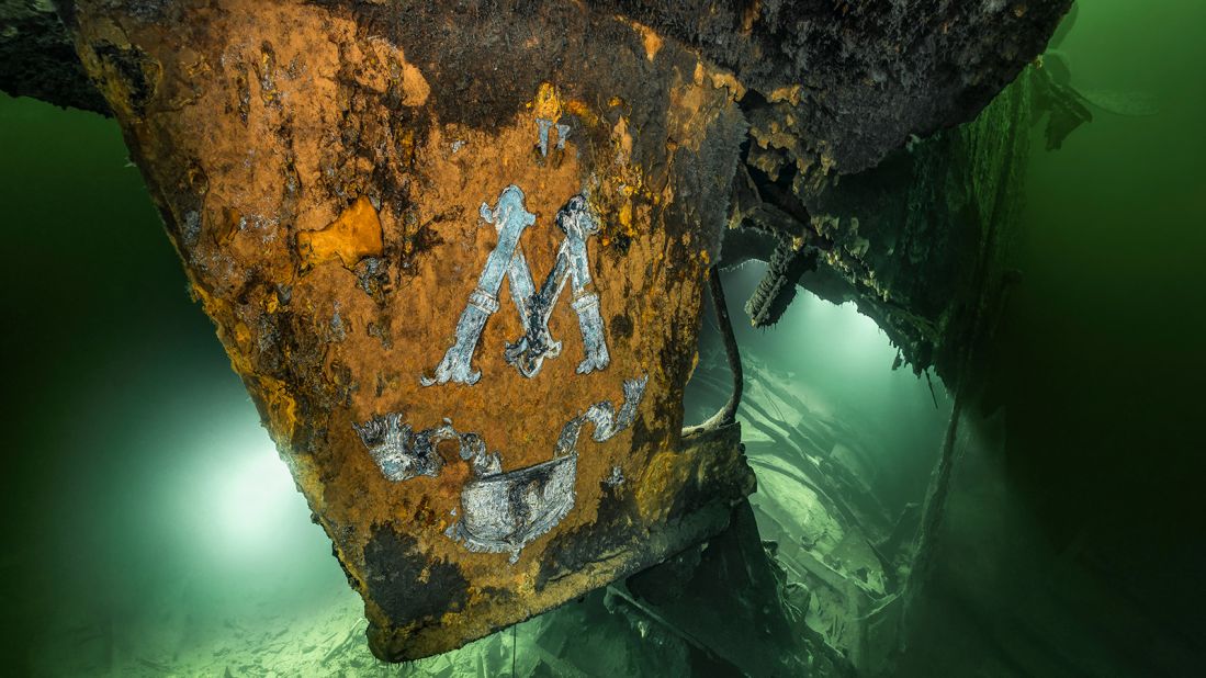 <strong>Capturing atmosphere:</strong> Dahm and Douglas and their team of divers use flashlights to illuminate details for the photos. They also try to capture the atmosphere of the murky waters. Pictured here: the SMS Prinz Adalbert, another German ship that sank during the First World War. The ship was broken in two, and this picture depicts what remains of the ship's stern.