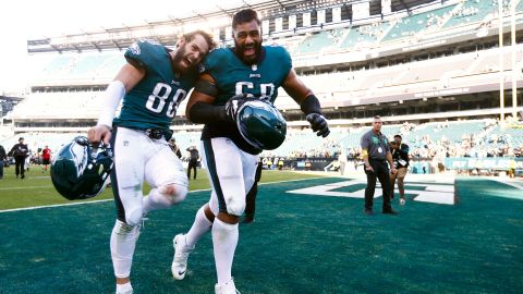 Philadelphia Eagles tight end Dallas Goedert and Mailata run off the field after defeating the Pittsburgh Steelers.