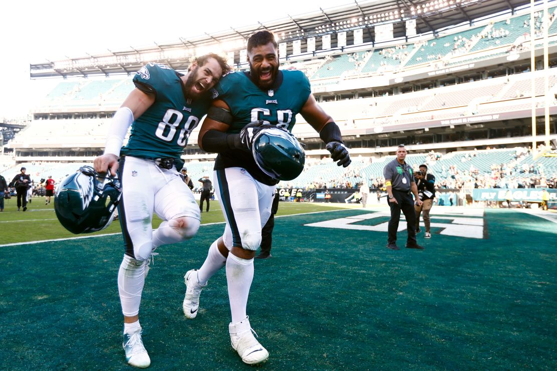 Philadelphia Eagles tight end Dallas Goedert and Mailata run off the field after defeating the Pittsburgh Steelers.