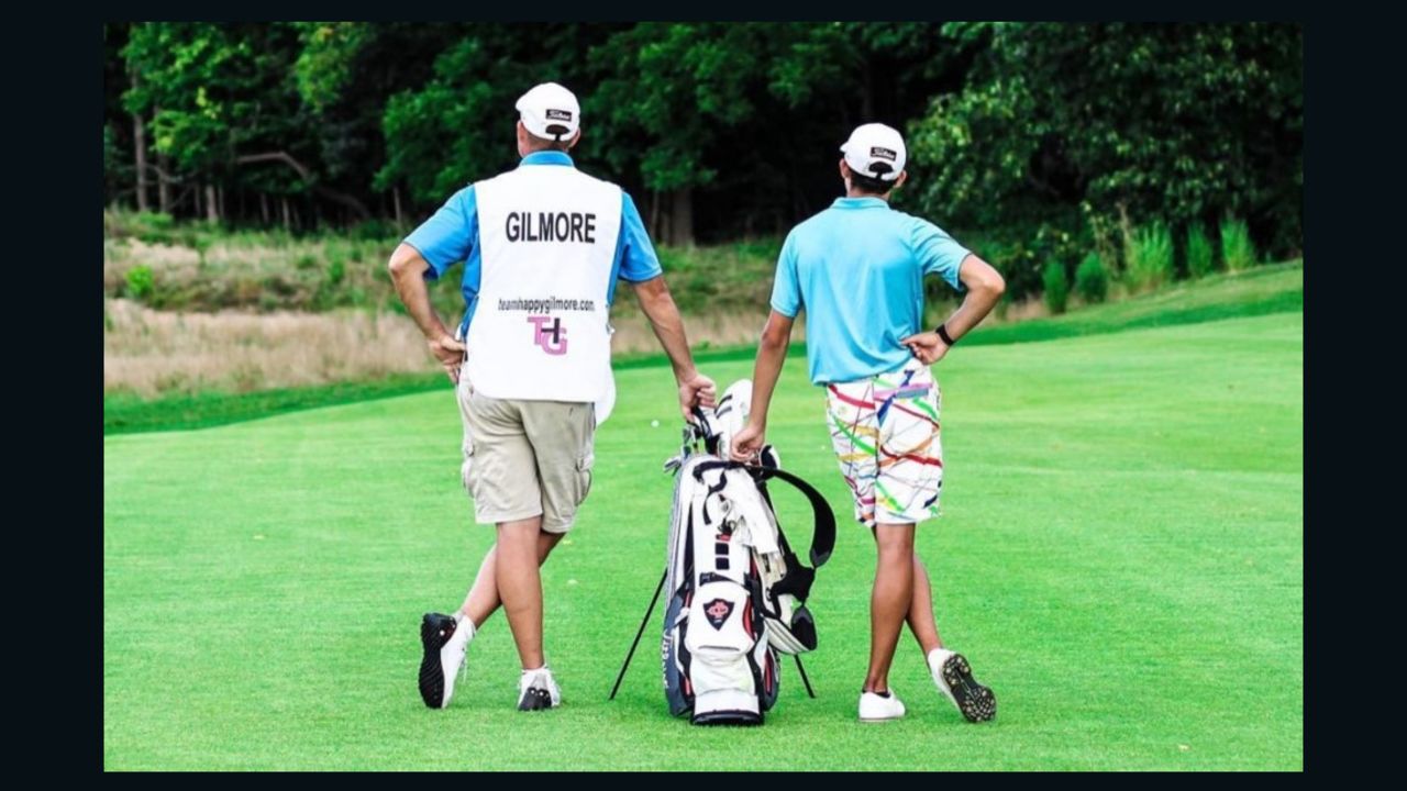 Gilmore (right) and caddie Chris Blackmore weigh up the next shot.