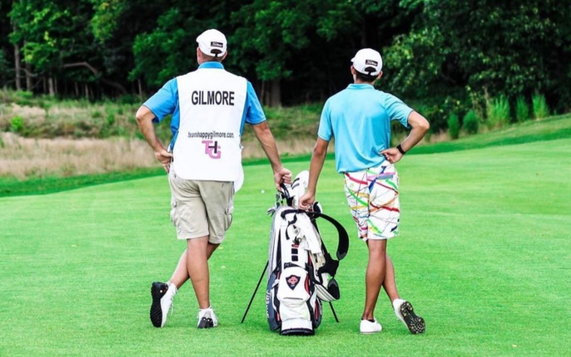 Gilmore (right) and caddie Chris Blackmore weigh up the next shot.