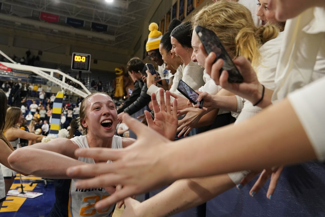 Marquette's Jordan King celebrates with fans following the Eagles' win.