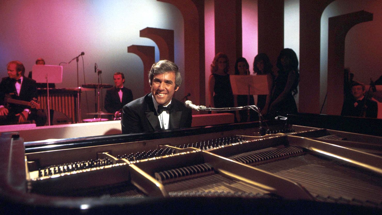 American composer, songwriter, singer and pianist Burt Bacharach performs on his piano circa 1968 in Los Angeles, California. 