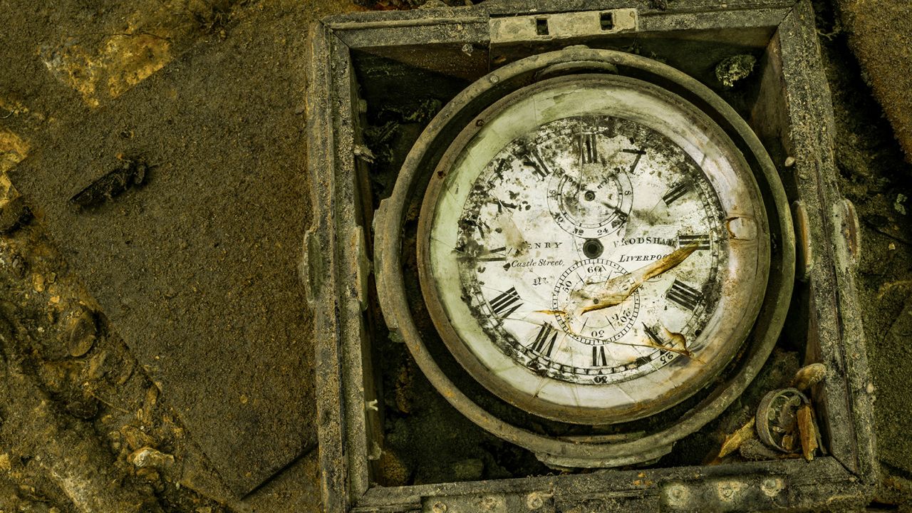 This is a close-up shot of a ship's chronometer -- a type of clock -- on one of the wrecks.