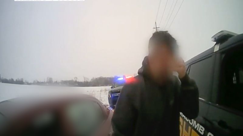 NextImg:Watch: Man in distress makes unexpected request to police officers | CNN