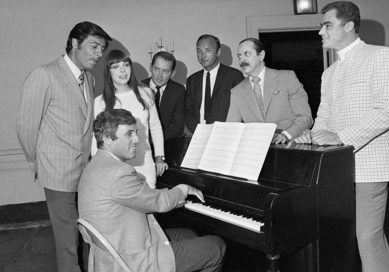 Bacharach plays the piano at the first rehearsal of his first Broadway musical, "Promises, Promises" in 1968. Joining Bacharach, from left, are actors Jerry Orbach and Jill O'Hara, director Robert Moore, author Neil Simon, producer David Merrick and actor Edward Winter.