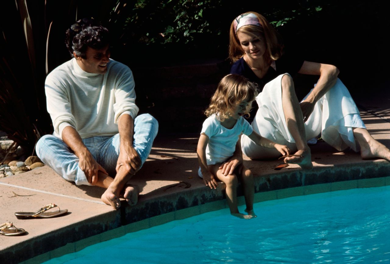 Bacharach, Dickinson and their daughter Nikki sit around the swimming pool of their Hollywood home in 1969.