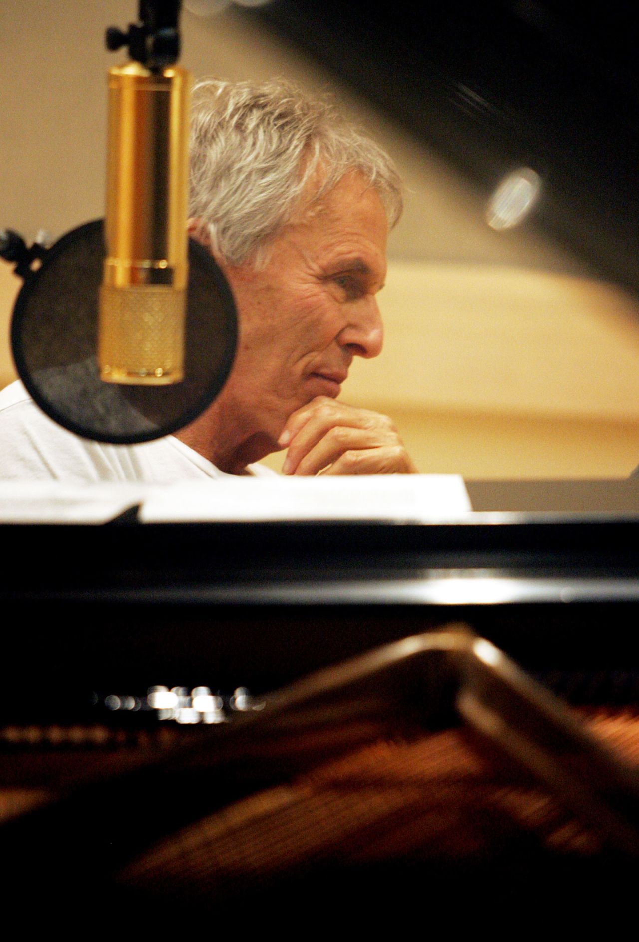 Bacharach listens while jazz pianist Marian McPartland plays a tune during a radio taping in 2004.