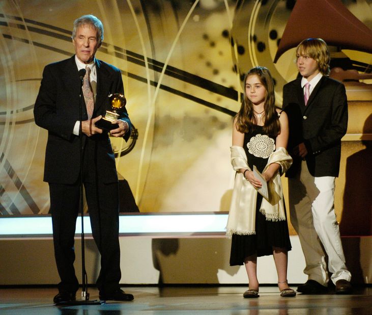 Bacharach stands on stage with his children Raleigh and Oliver after winning a Grammy for best pop instrumental album in 2006.
