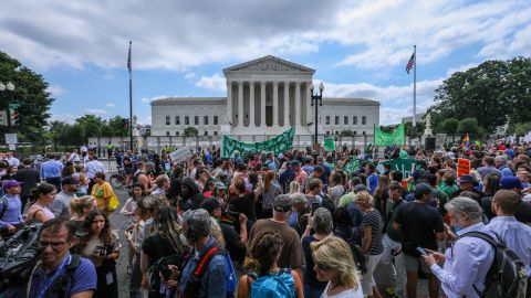 Abortion rights demonstrators hold signs outside the US Supreme Court in Washington after the court overturned Roe v. Wade in June 2022.