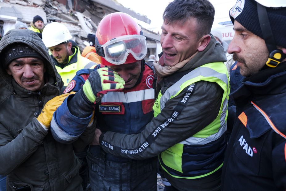 Firefighter Erhan Sarac and other rescue team members celebrate after a successful evacuation in Elbistan, Turkey, on February 9.