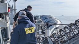 FBI Underwater Search Evidence Response Team (USERT) Members ready equipment to recover material from the ocean floor.