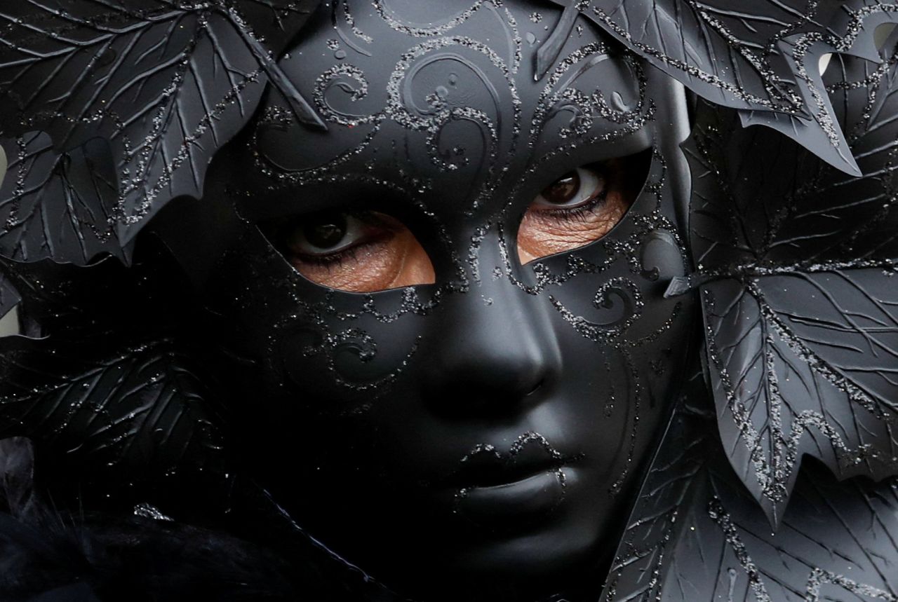 A masked reveler takes part in the Venice carnival in Venice, Italy, on Sunday, February 5.