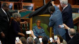 Opal Lee, second from left, who worked to help make Juneteenth a federally-recognized holiday, reacts with state Sen. Royce West, left, as her portrait is unveiled in the Texas Senate Chamber, Wednesday, Feb. 8, 2023, in Austin, Texas. (AP Photo/Eric Gay)
