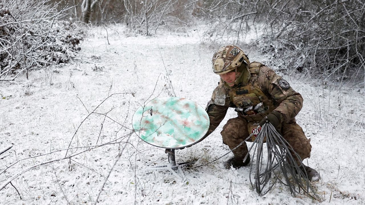 A Ukrainian soldier disconnects their Starlink on the front line   during a ceasefire announced by Russia over the Orthodox Christmas period,  January 6, 2023. 