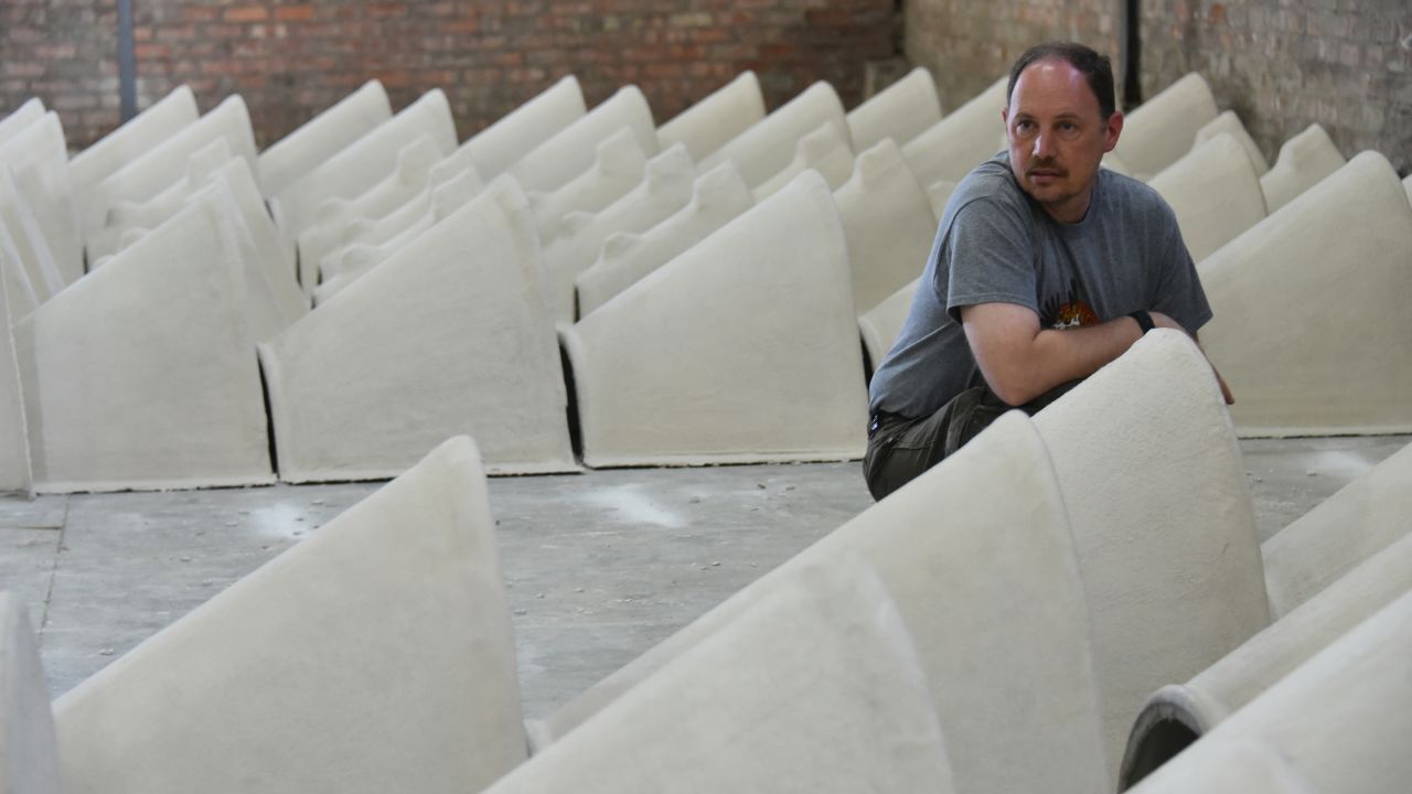 Kevin Graham, coordinator of the African Penguin Nest Project, surveys rows of newly manufactured nests.