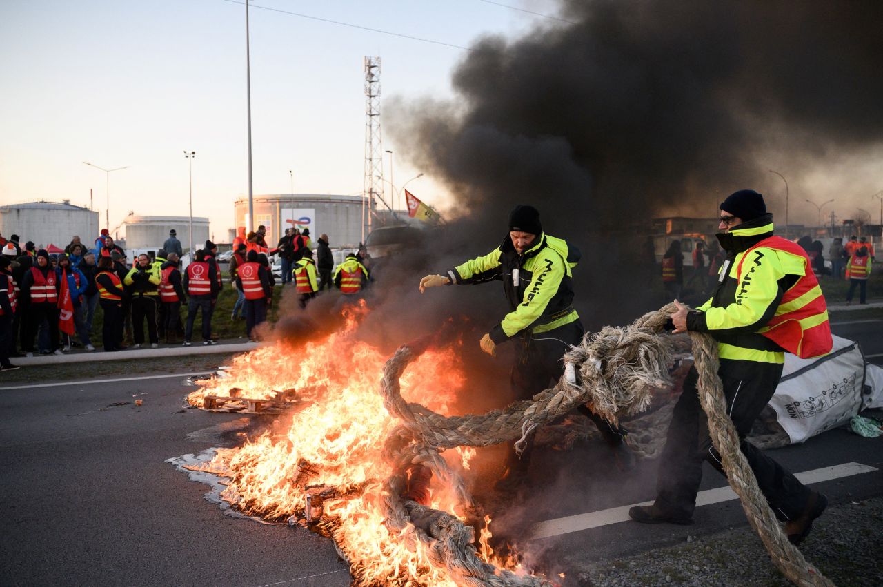 Protesters set a fire in Donges, France, blocking a road in front of the Total Energies refinery on Wednesday, February 8. Many of France's largest unions have been protesting <a href="https://www.cnn.com/2023/01/18/intl_business/france-pension-protests/index.html" target="_blank">radical reforms to the country's pension system</a> that, if implemented, would require most people in France to work two years longer before retirement.