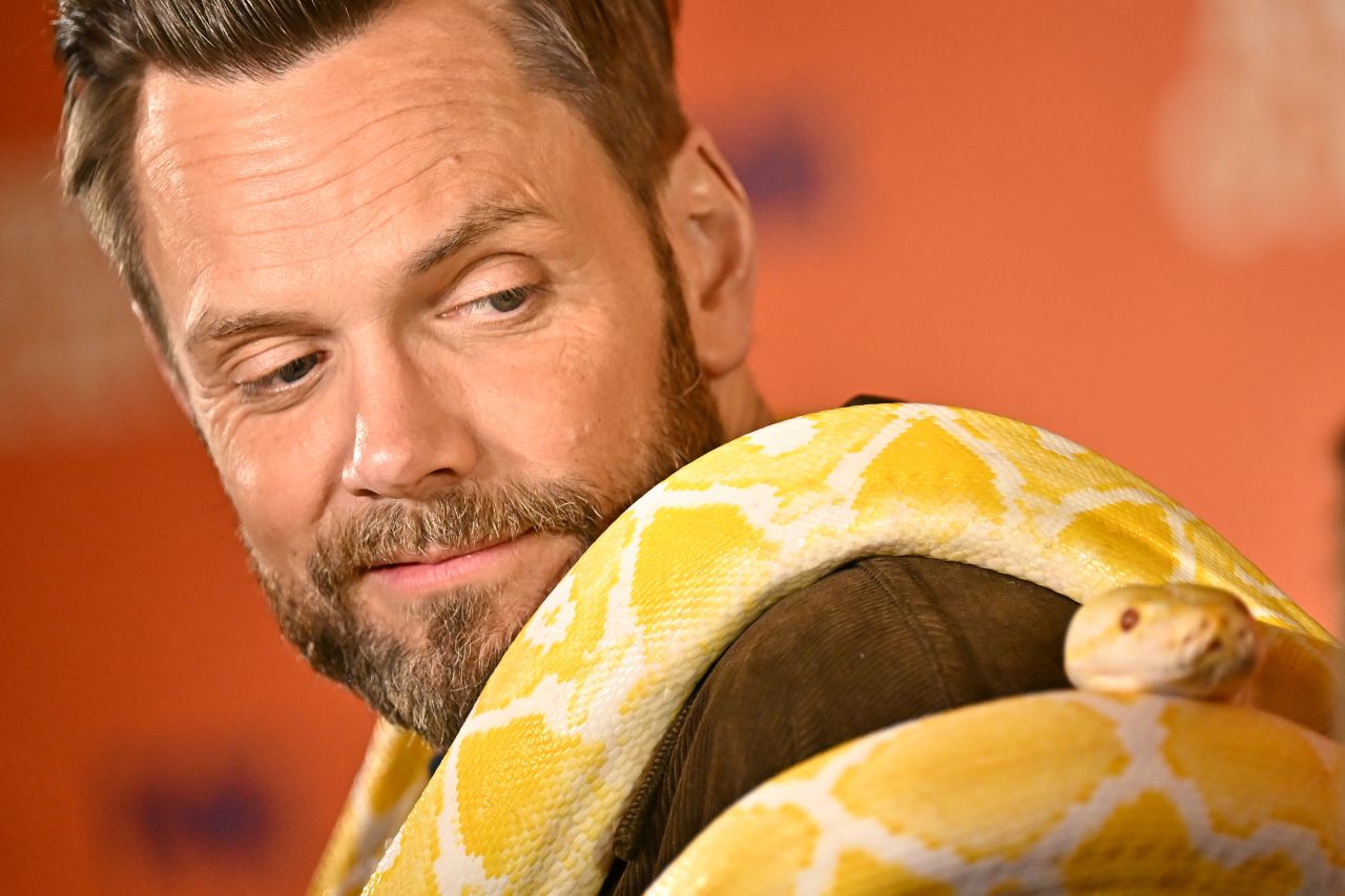 Actor Joel McHale and a snake attend the Los Angeles premiere of his new show "Animal Control" on Tuesday, February 7.