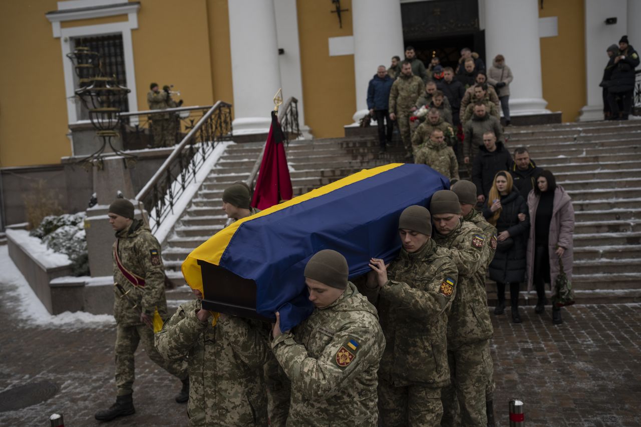 Soldiers carry the coffin of Eduard Strauss, a Ukrainian serviceman who died in combat, during a farewell ceremony in Kyiv, Ukraine, on Monday, February 6.