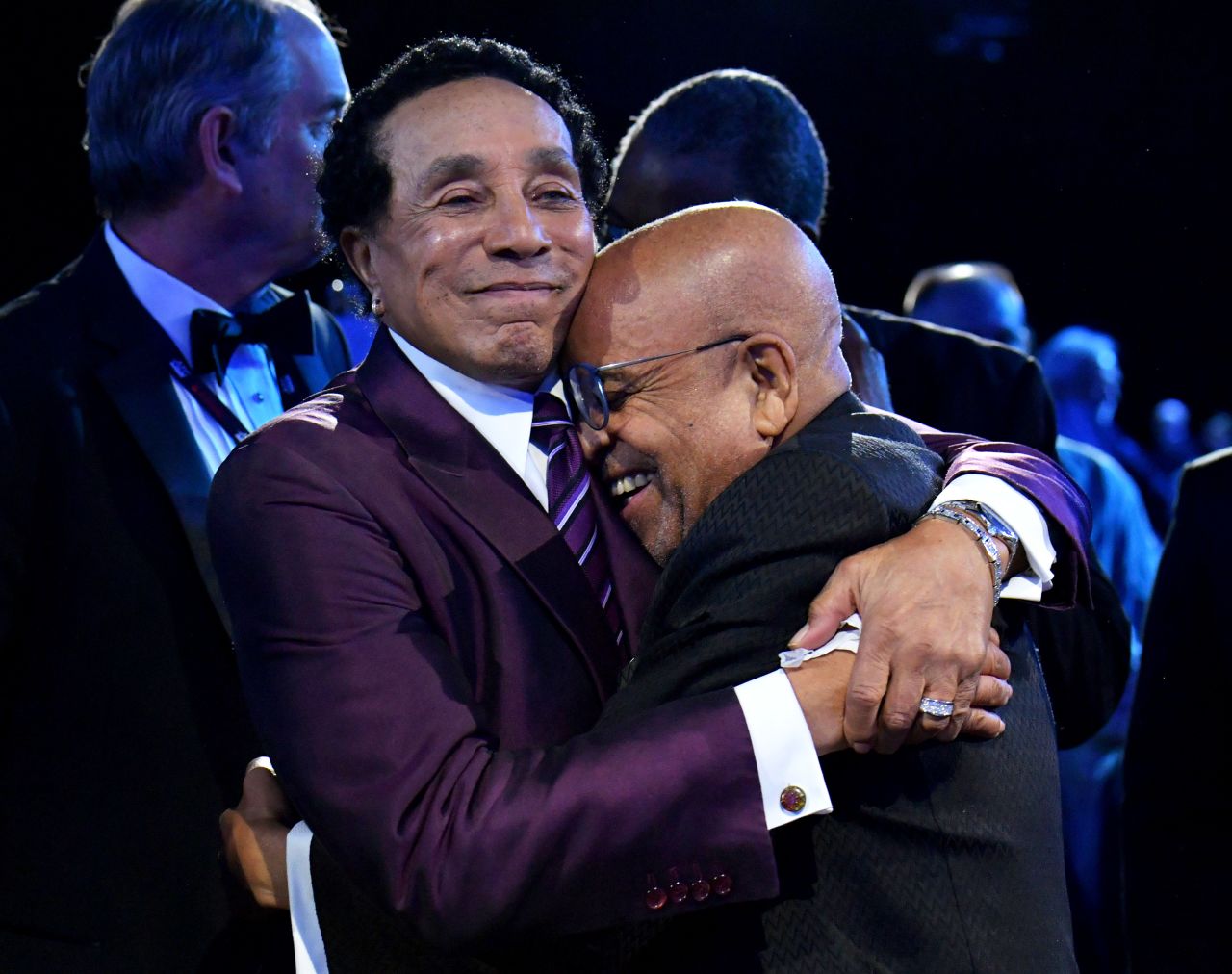Musical legends Smokey Robinson, left, and Berry Gordy embrace each other as they are recognized as MusiCares' Persons of the Year on Friday, February 3. MusiCares is the philanthropic arm of the National Academy of Recording Arts and Sciences.