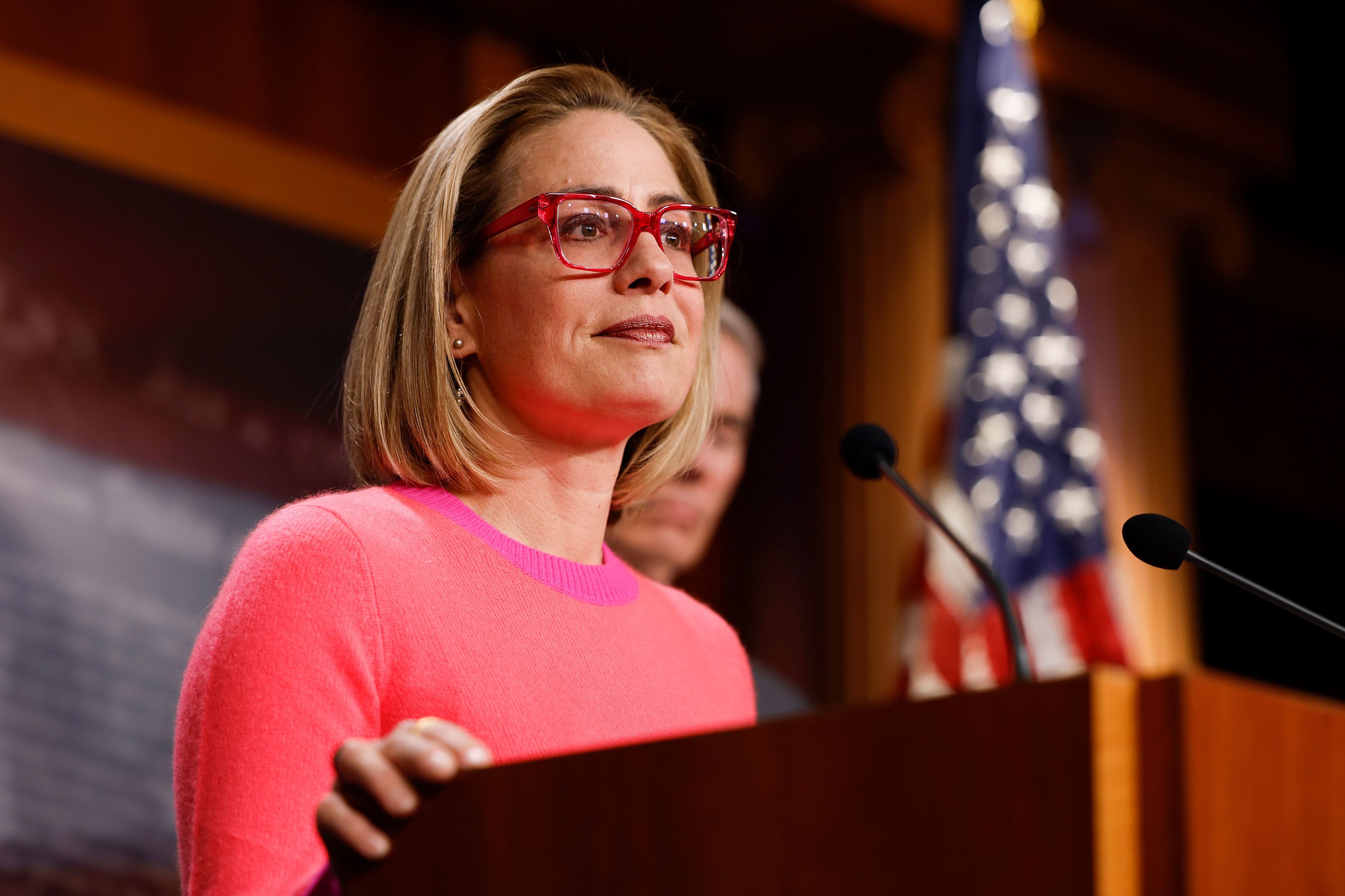 WASHINGTON, DC - NOVEMBER 29:  U.S. Sen. Kyrsten Sinema (D-AZ) speaks at a news conference after the Senate passed the Respect for Marriage Act at the Capitol Building on November 29, 2022 in Washington, DC. In a 61-36 vote, the measure would provide federal recognition and protection for same-sex and interracial marriages. (Photo by Anna Moneymaker/Getty Images)