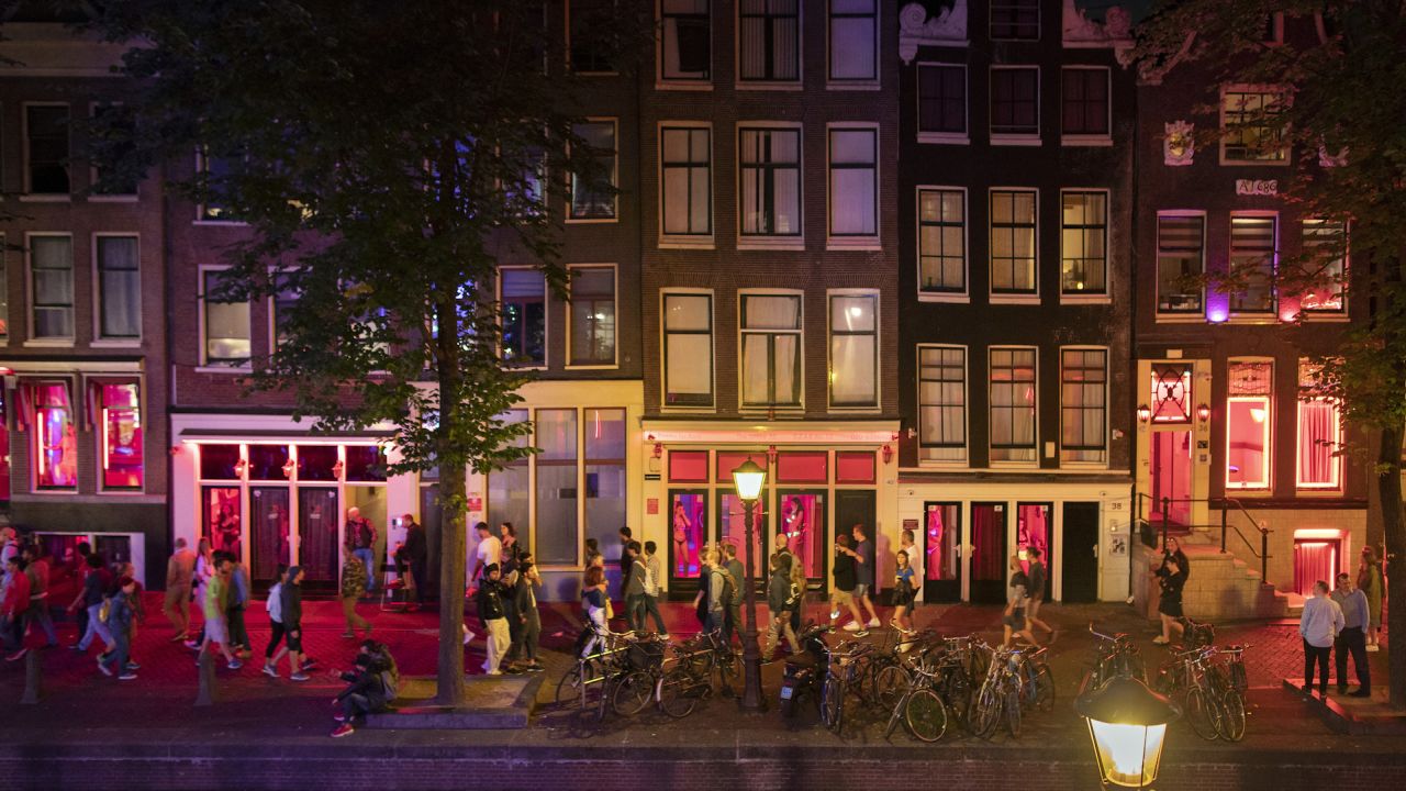 Sidewalks are often packed with tourists in the Red Light district in Amsterdam.