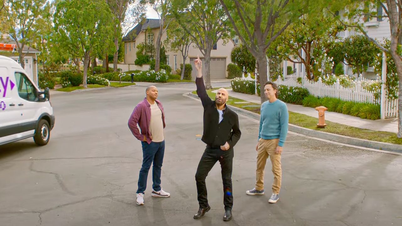 (From left) Donald Faison, John Travolta and Zach Braff in a new ad for T-Mobile Home Internet.