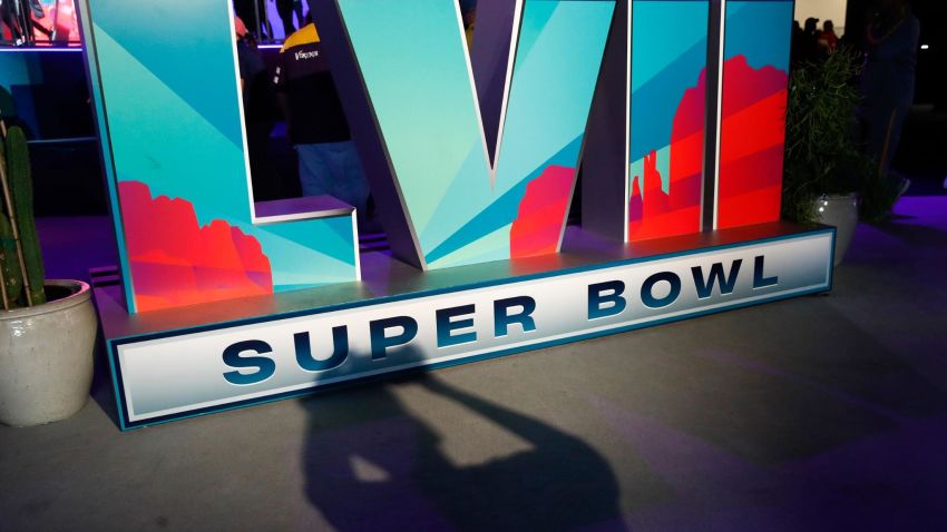 A fan takes a photo of the LVII Super Bowl signage on display during the NFL Experience at the Phoenix Convention Center in Phoenix, Arizona, USA, 09 February 2023. The Philadelphia Eagles and the Kansas City Chiefs will play in Super Bowl LVII at State Farm Stadium in Glendale, Arizona, USA on 12 February 2023.