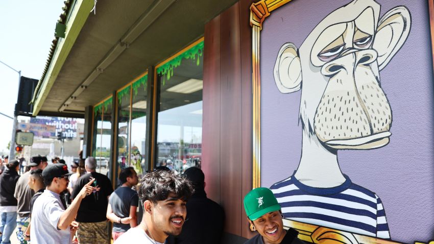 People wait in line at the April 2022 grand opening of the Bored & Hungry pop-up burger restaurant in Long Beach, California, which used Bored Ape images.