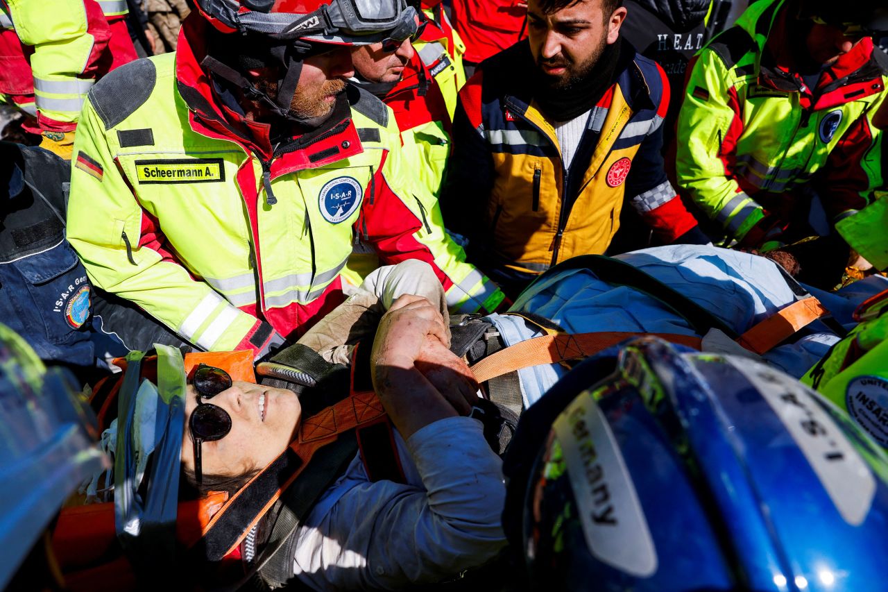 Rescuers carry Zeynep Kahraman after <a href="https://www.reuters.com/world/middle-east/after-104-hours-buried-by-turkey-earthquake-woman-brought-out-alive-2023-02-10/" target="_blank" target="_blank">pulling her alive</a> from the rubble of a building in Kirikhan, Turkey, on February 10.