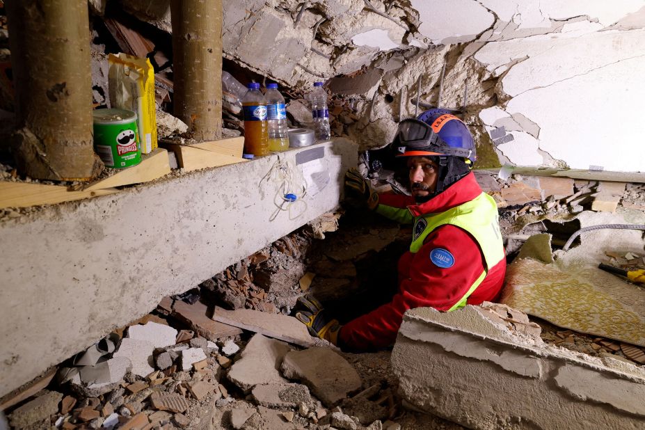 A rescuer shows a hole where he was speaking to Kahraman while she was still under the debris on Thursday, February 9.