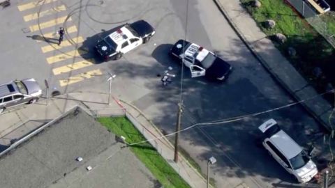 In this Dec. 1, 2017 file image taken from video provided by KTVU-TV, San Francisco police investigate an officer-involved shooting in the city's Bayview neighborhood in San Francisco. A rookie San Francisco police officer who was on his fourth day on the job when he fatally shot an unarmed carjacking suspect in the city's Bayview neighborhood has been fired. Police Chief Bill Scott fired officer Chris Samayoa three months after he fatally shot 42-year-old Keita O'Neil, the San Francisco Chronicle reported Tuesday, March 13, 2018. 