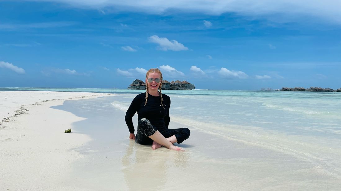 <strong>World traveler: </strong>Bruns, seen in the Maldives in 2022, notes that it "hasn't been easy to navigate a world designed for people who use two legs."