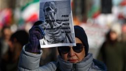 A woman holds a sign during a march to the U.S. Department of State Harry S. Truman building in Washington, D.C. on February 4, 2023 in memory of Mahsa Amini and to call for an end to human rights violations in Iran. (Photo by Bryan Olin Dozier/NurPhoto via AP)