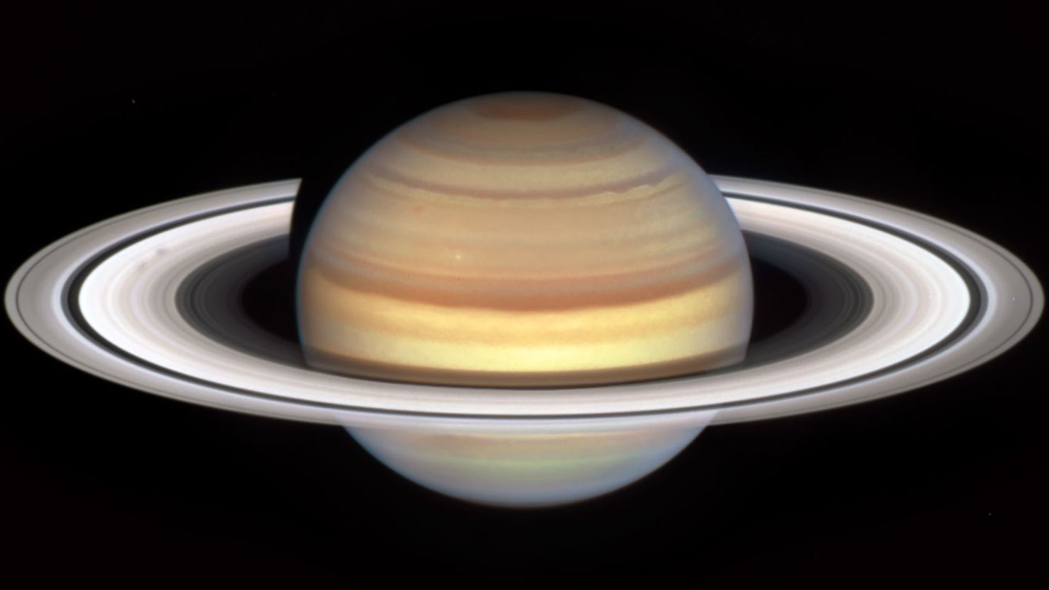 An image captured by NASA's Hubble Space Telescope's marks the start of Saturn's "spoke season," with the appearance of two smudgy spokes (at left) in the B ring.
