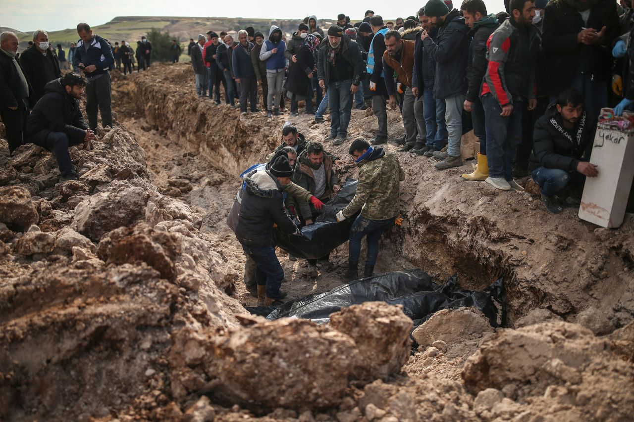 People bury earthquake victims in Adiyaman, Turkey, on Friday, February 10. Tens of thousands of people have died after a <a href="https://www.cnn.com/2023/02/06/world/gallery/earthquake-turkey-syria-2023/index.html" target="_blank">7.8 magnitude earthquake</a> rocked Turkey and Syria on February 6.