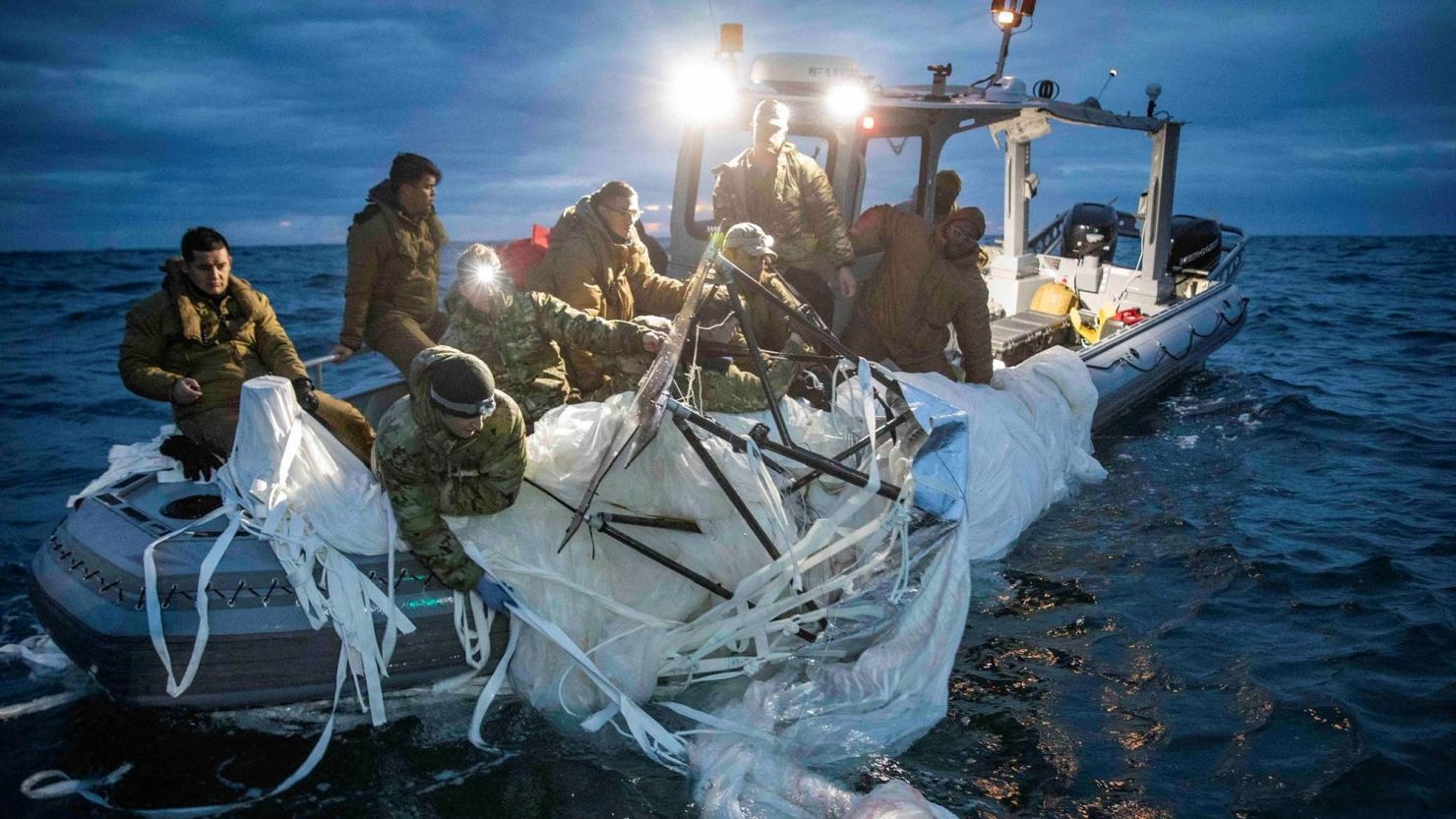 US sailors recover a suspected Chinese high-altitude surveillance balloon that was downed by the United States over US territorial waters off the coast of Myrtle Beach, South Carolina, on February 5, 2023.