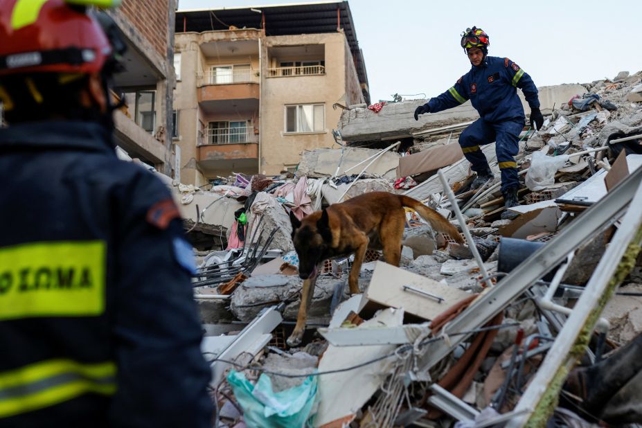 Members of a Greek rescue team work at the site of a collapsed building in Hatay, Turkey, on Saturday, February 11.