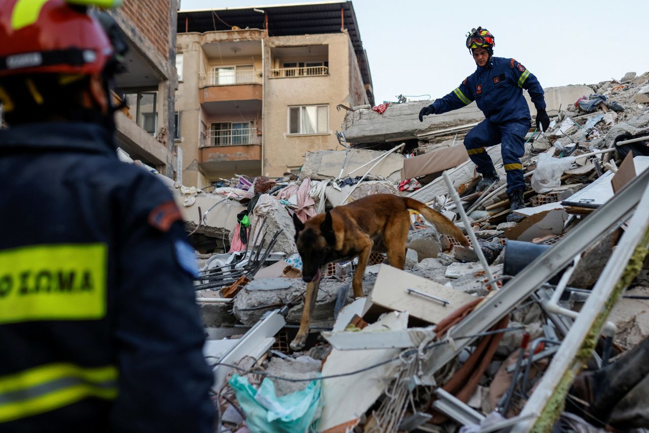 Members of a Greek rescue team work at the site of a collapsed building in Hatay on Saturday, February 11. 
