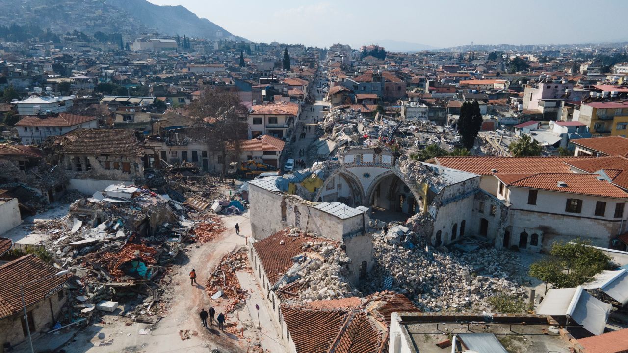 Residents walk near a destroyed mosque in Antakya, Turkey, on February 10.