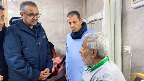 World Health Organization (WHO) Director-General Dr Tedros Adhanom Ghebreyesus speaks with a man visiting earthquake survivors in a hospital in Aleppo.
