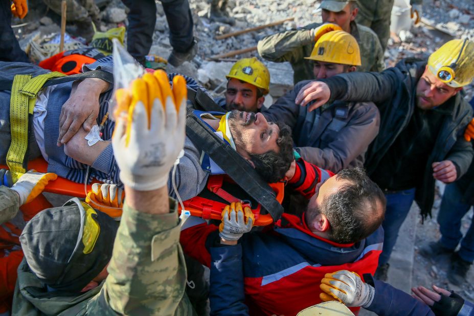 Sezai Karabas is put on a stretcher after being rescued from rubble on February 11, in Gaziantep, Turkey. Karaba's young daughter Sengul was also rescued.