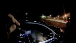 In this screengrab from a bodycam video released by the Raleigh Police Department, a police officer shines a flashlight into a car with Darryl Tyree Williams in the driver's seat.